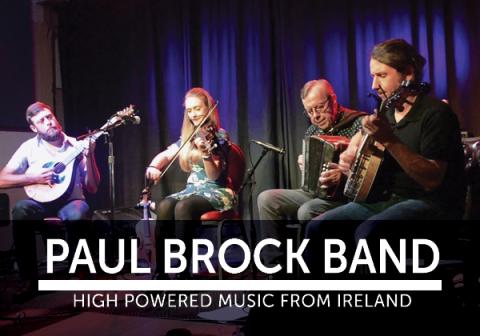 Photo of the Paul Brock Band playing instruments on stage