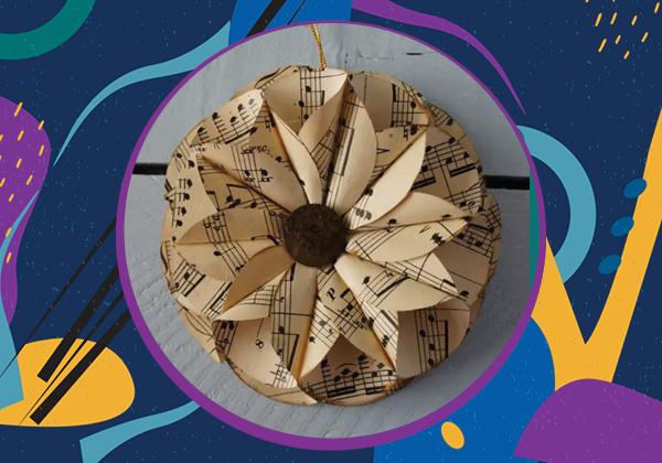 Photo of a hanging floral ornament made from sheet music